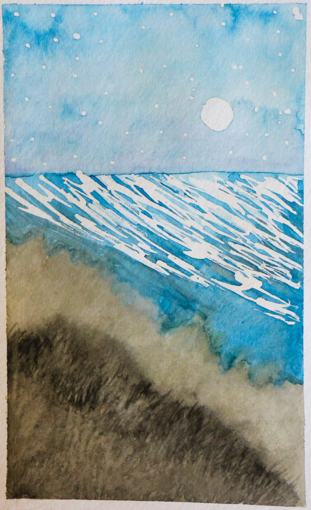 Moonlit ocean with shadowy dunes in foreground